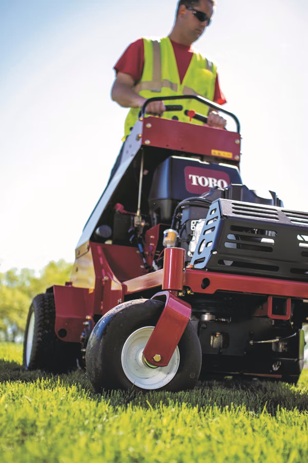 Toro_Stand_On_Aerator_action_close_up.56fecf98ab991